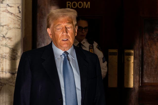 Former US President Donald Trump speaks to reporters as he takes a break during his civil fraud trial in New York City on October 18, 2023